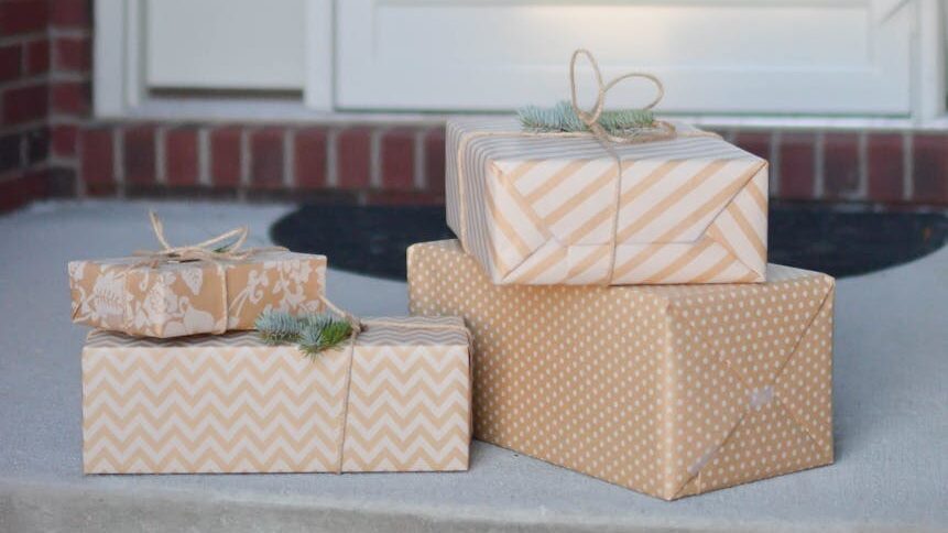 three beige colored boxes on the floor